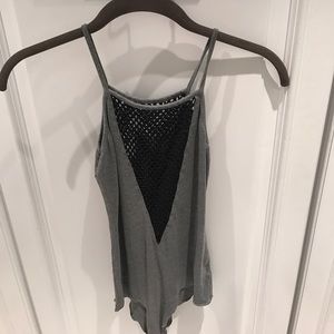 Grey body suit, with wide fishnet V neck