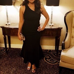 Black cocktail dress, fitted, and flattering