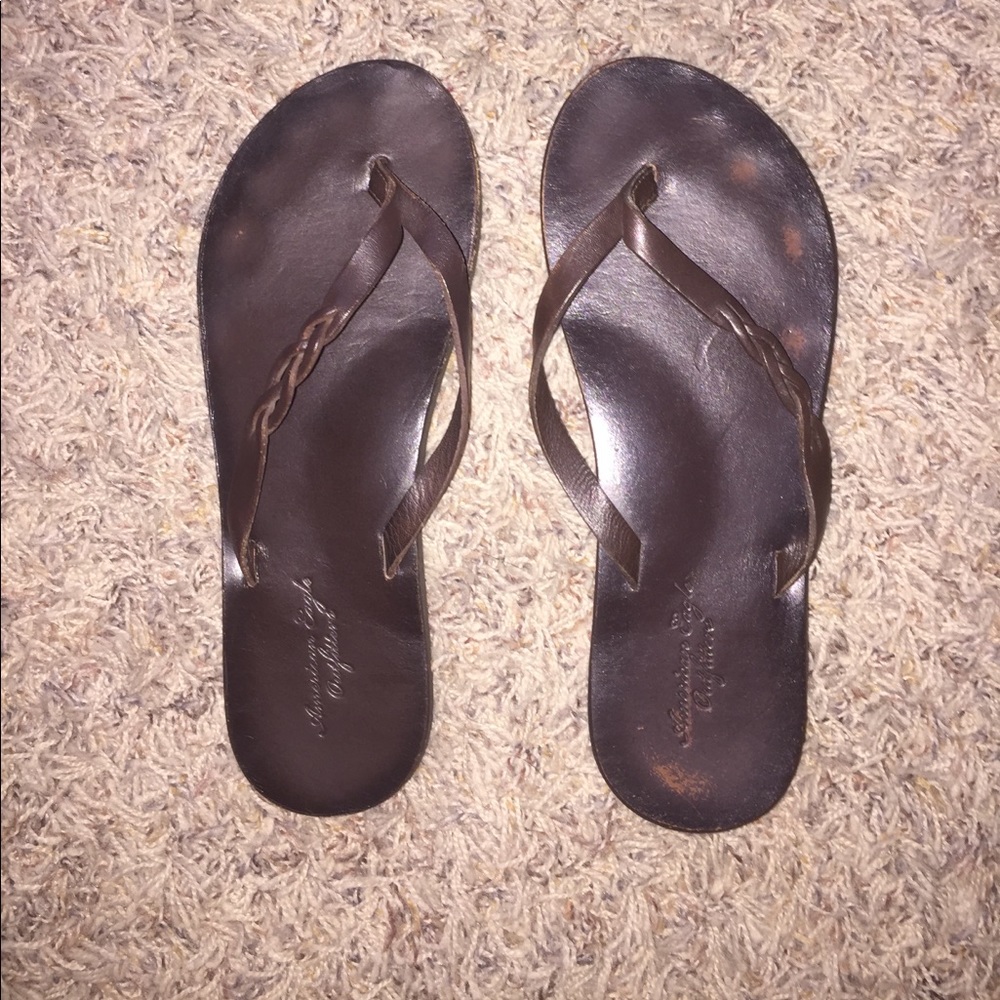 Brown leather flip flops