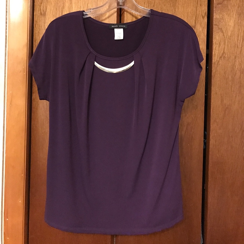 Top with metal decoration at neckline