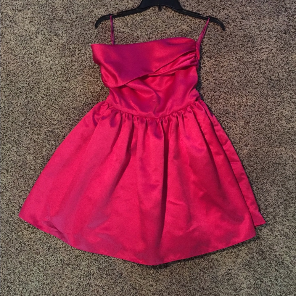 Short, pink bridesmaids dress.