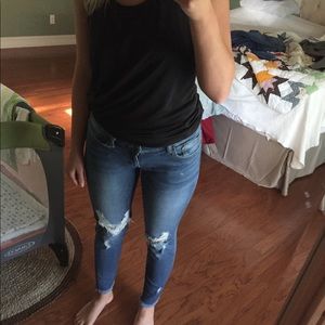 Dark denim jeans, frayed bottoms