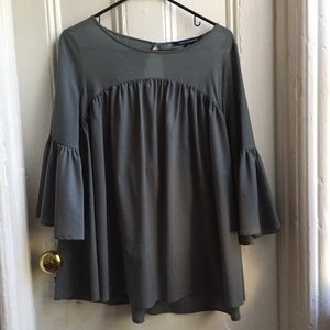 Flowing bell sleeve open back blouse