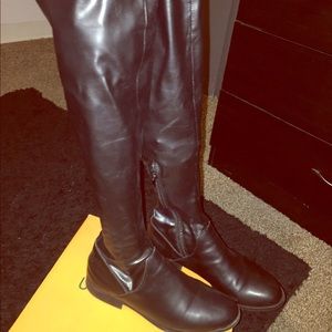 Black knee high fitted boots