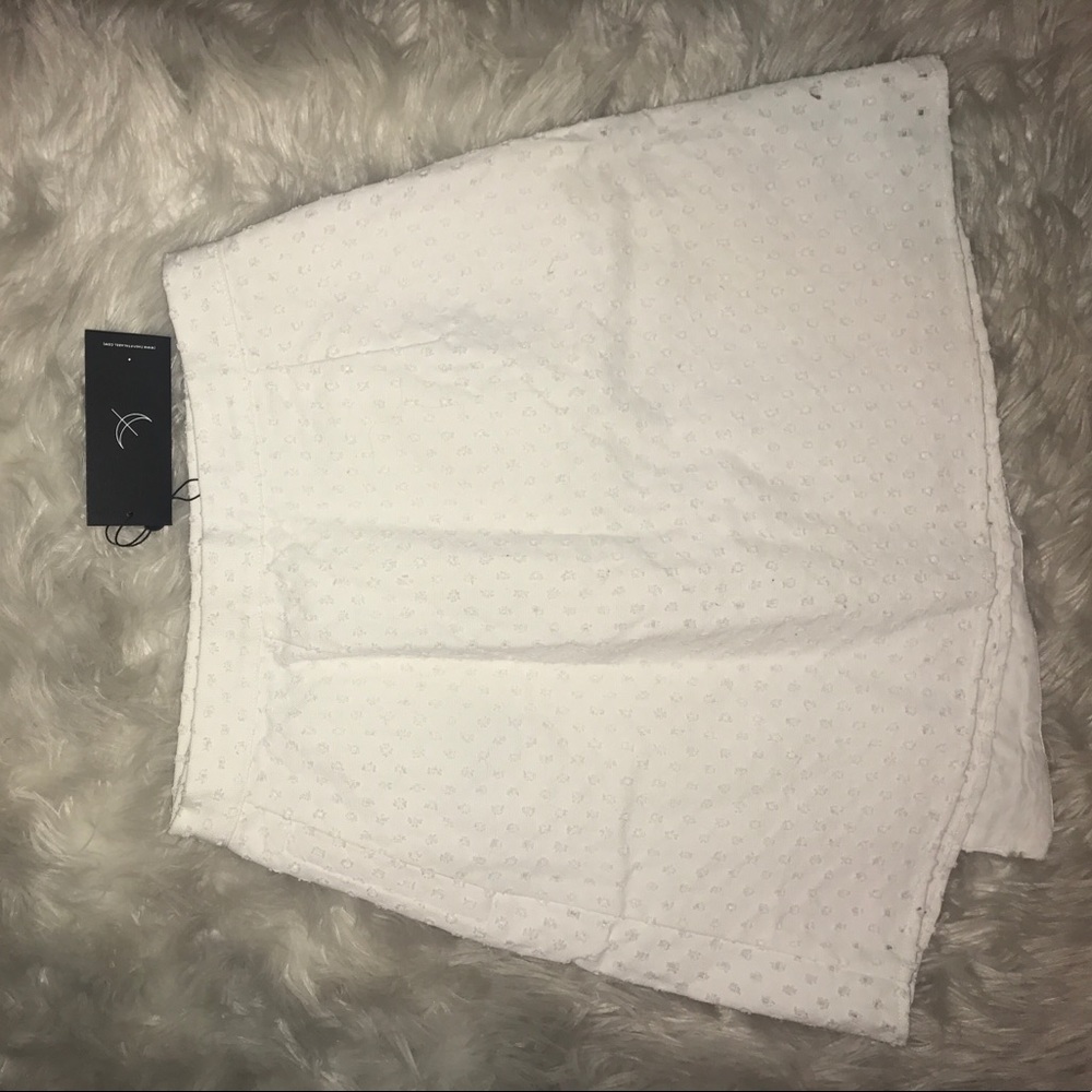 The fifth label white "the arrivals skirt"