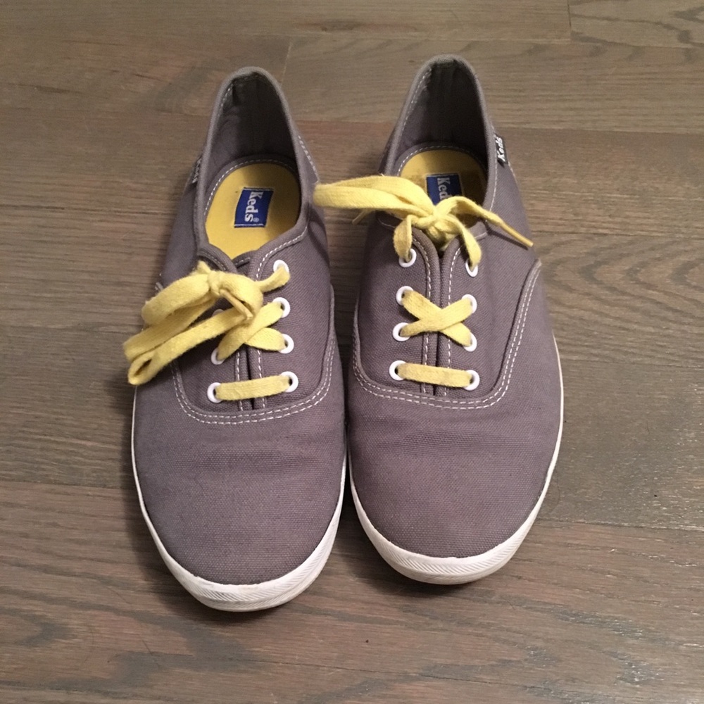 Gray and yellow keds