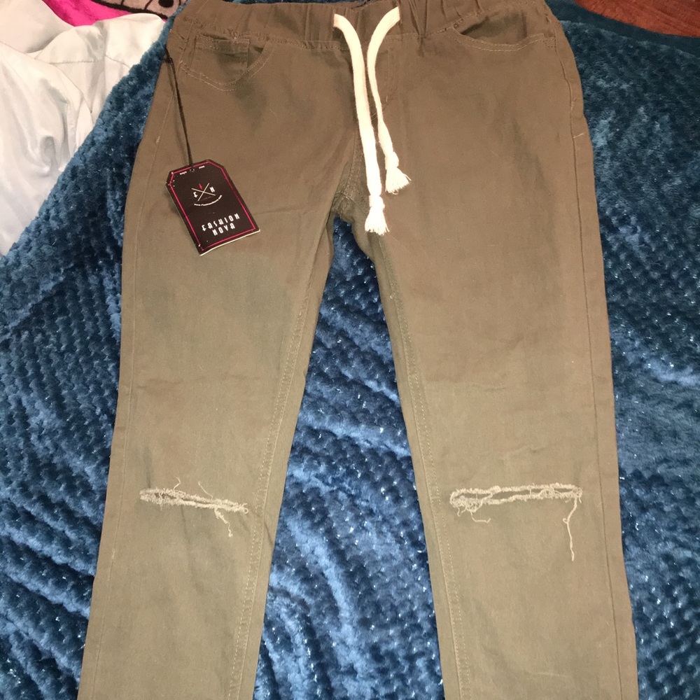Olive green jeggings w/ ripped knees