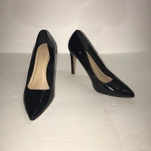 Black pointed toe pumps