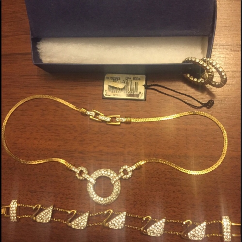 Swarovski earrings, necklace, and bracelet.