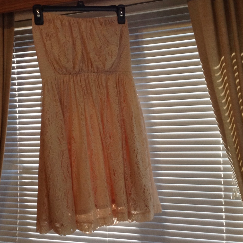 Peachy color strapless dress