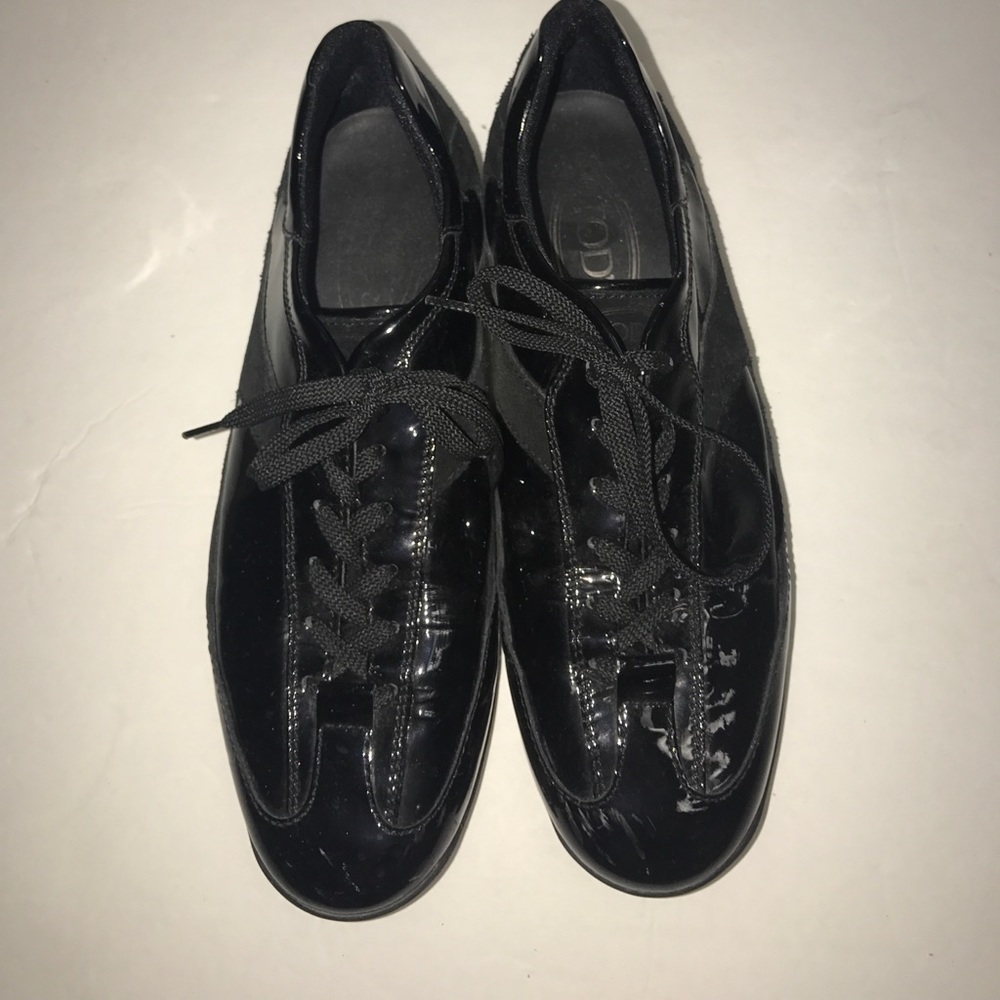Tod’s Black patent leather sneakers