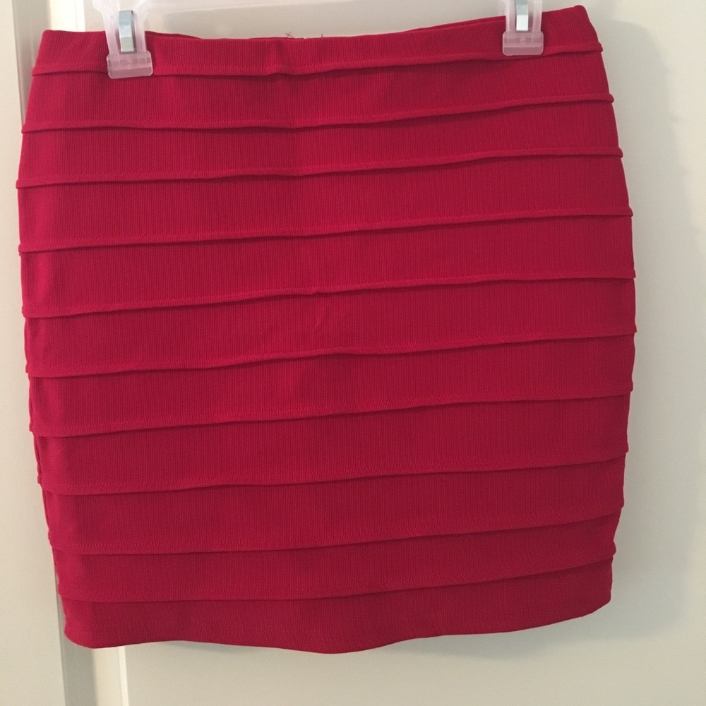 Red pleated mini skirt