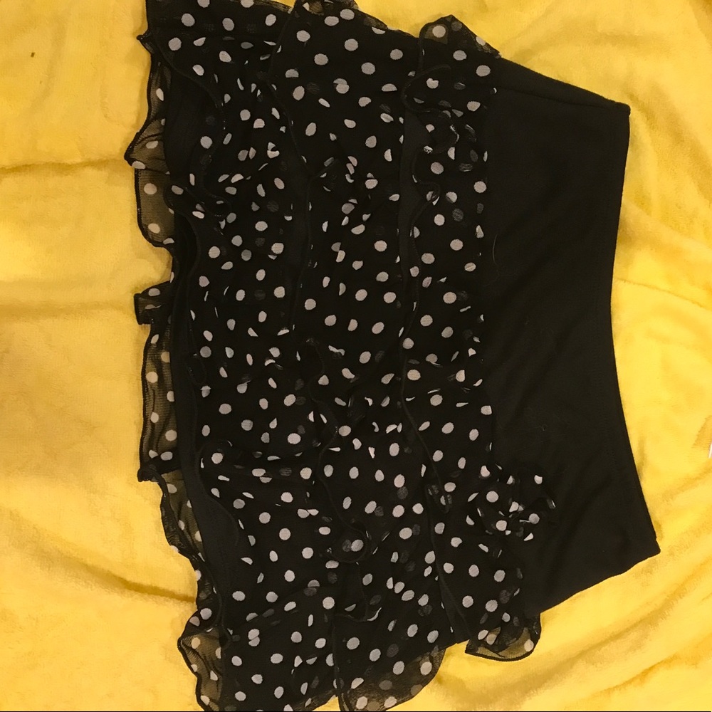 I'm selling a black skirt with white polka dots.