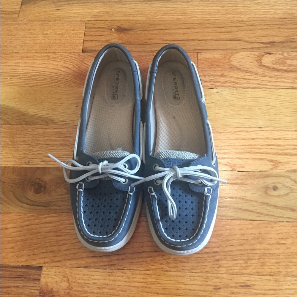 Navy Sperry Topsiders with cutout detail.