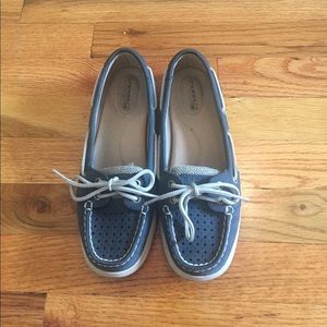 Navy Sperry Topsiders with cutout detail.