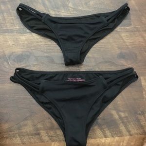 two pairs of black Victoria's Secret bottoms