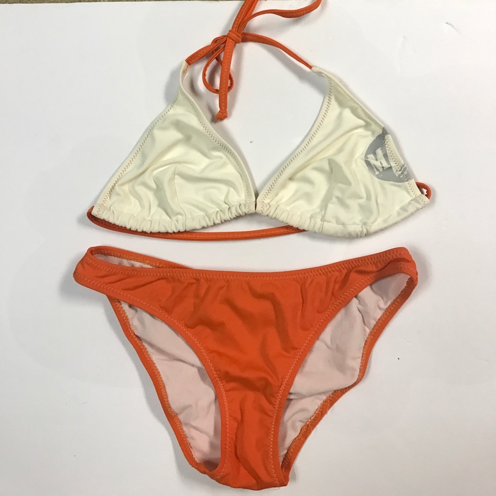 Orange and white suit top and bottom