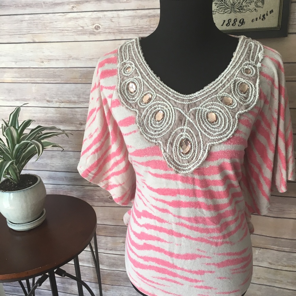 Animal print dolman sleeve blouse.