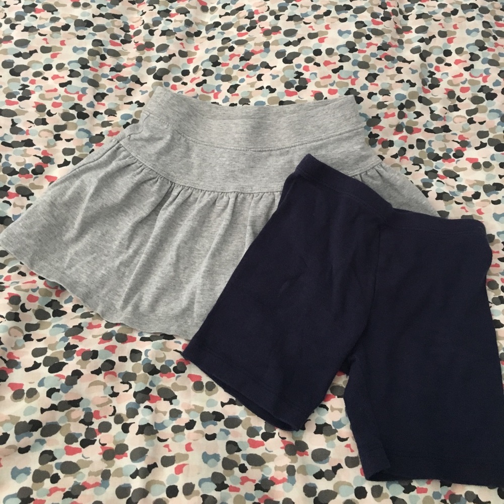 Bundle of girls bottoms. Grey skort, navy shorts