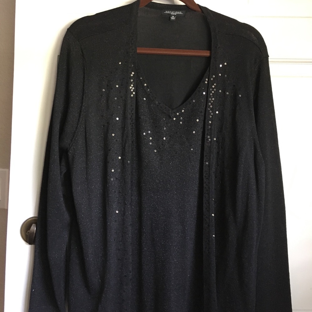 Woman's dressy black tunic/sweater.