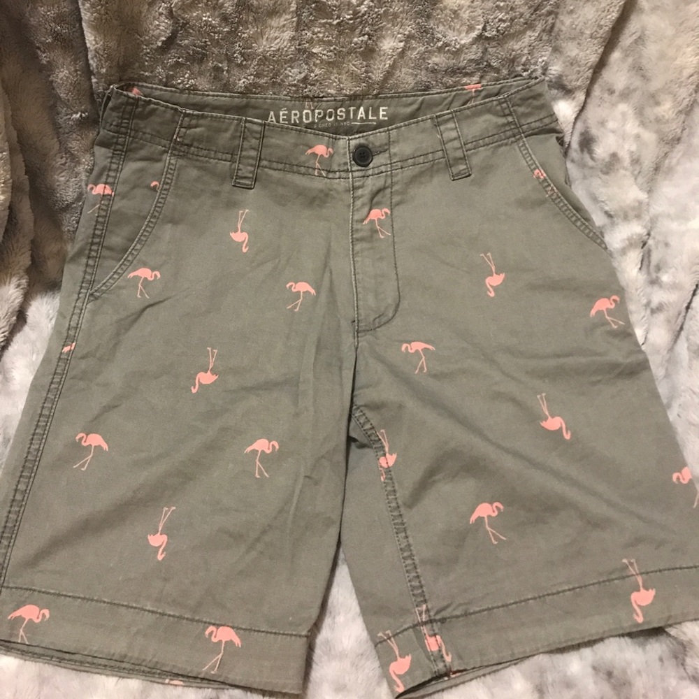 Grey shorts with pink flamingos.