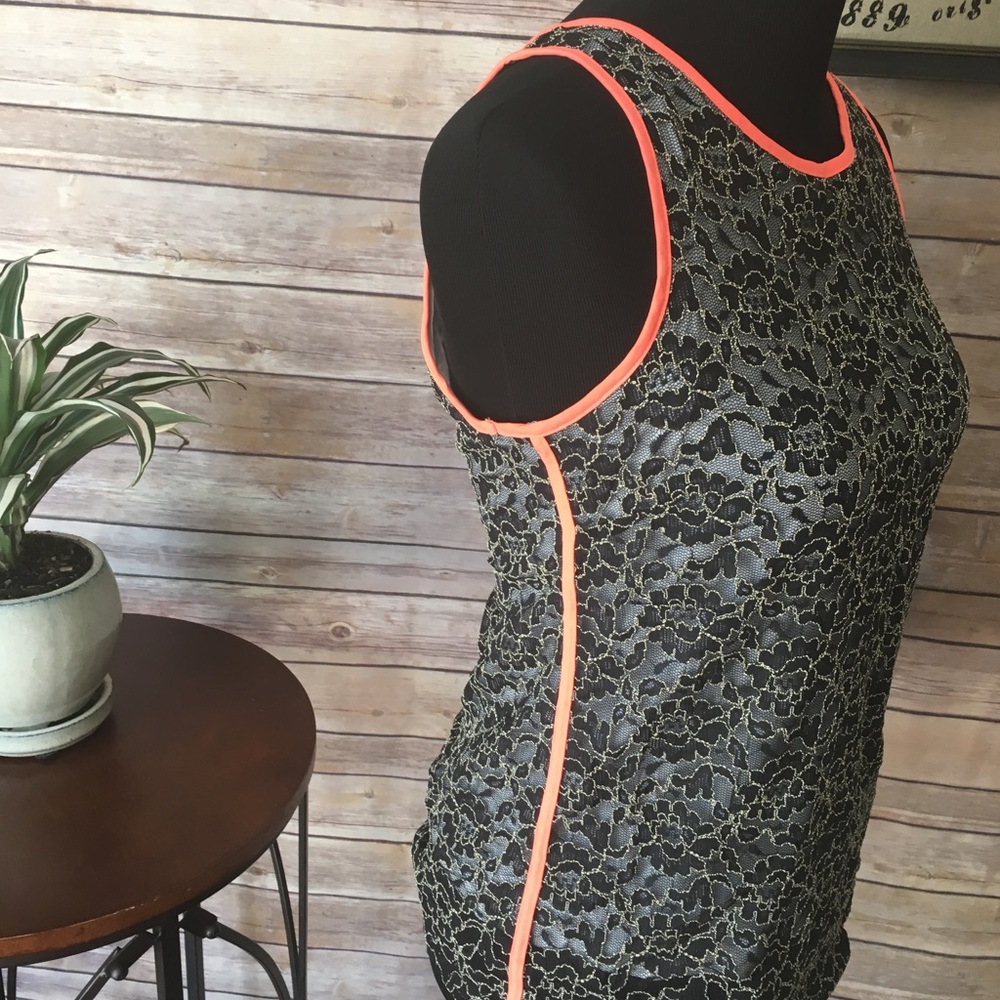 Lace sleeveless /orange contrasting piping.