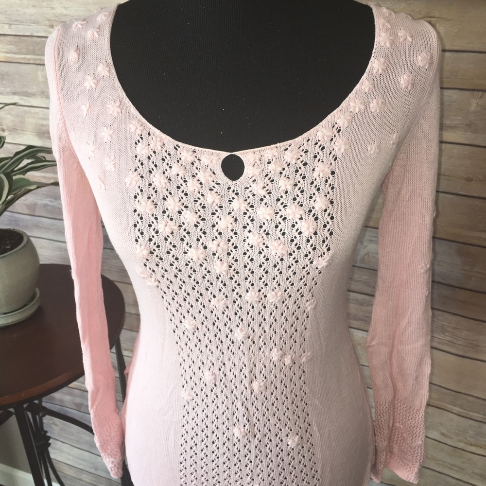 Dainty sweater with crochet flowers