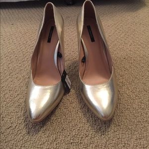 Gold pointed toe heels