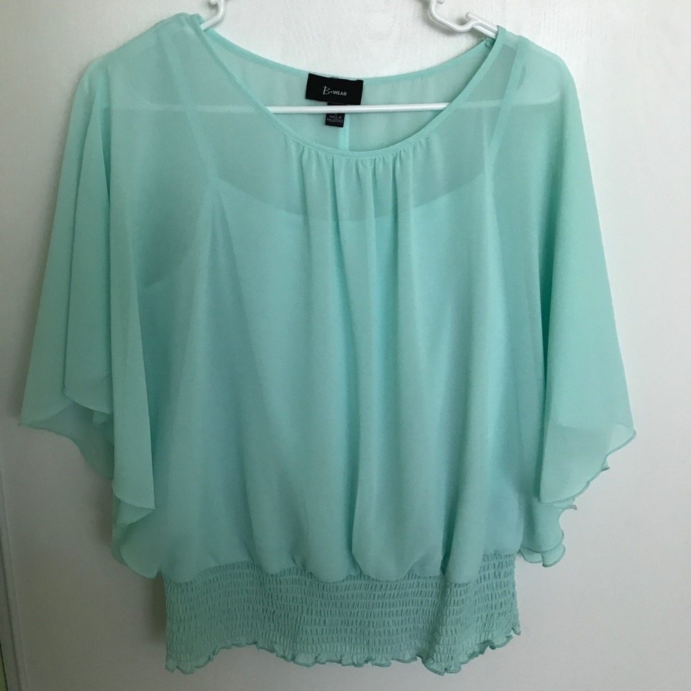 Turquoise blouse.