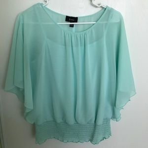 Turquoise blouse.