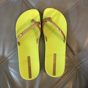 Lime green and gold Ipanema flip flops. Size 8/9