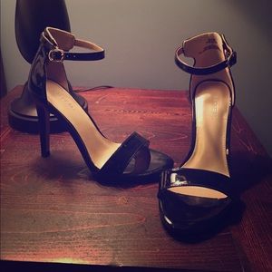 Brand new black paten leather heels. Never worn