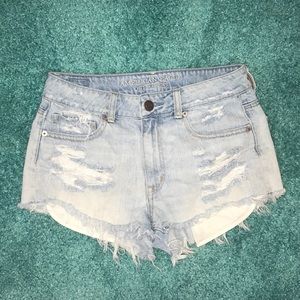 Light wash distressed American eagle cut offs