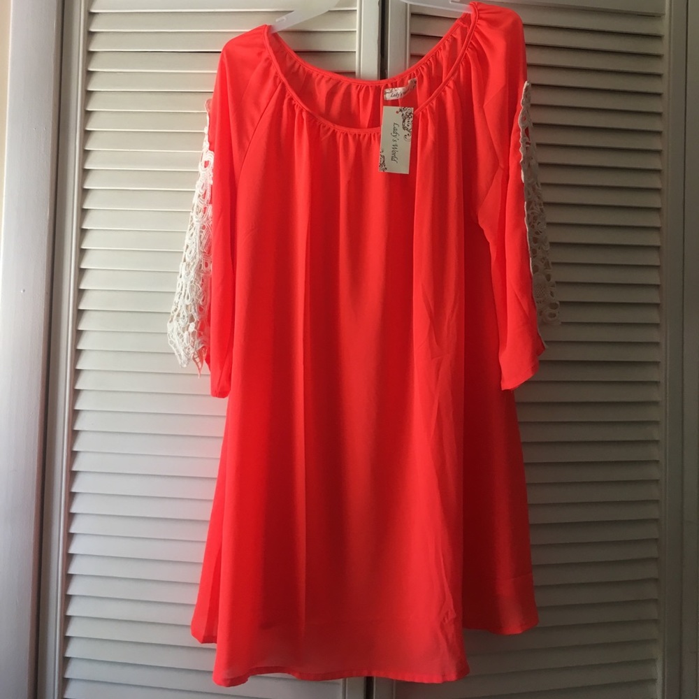 Neon orange and white lace sleeve dress.