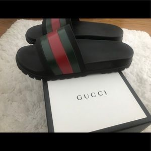 Men's Gucci Slides.