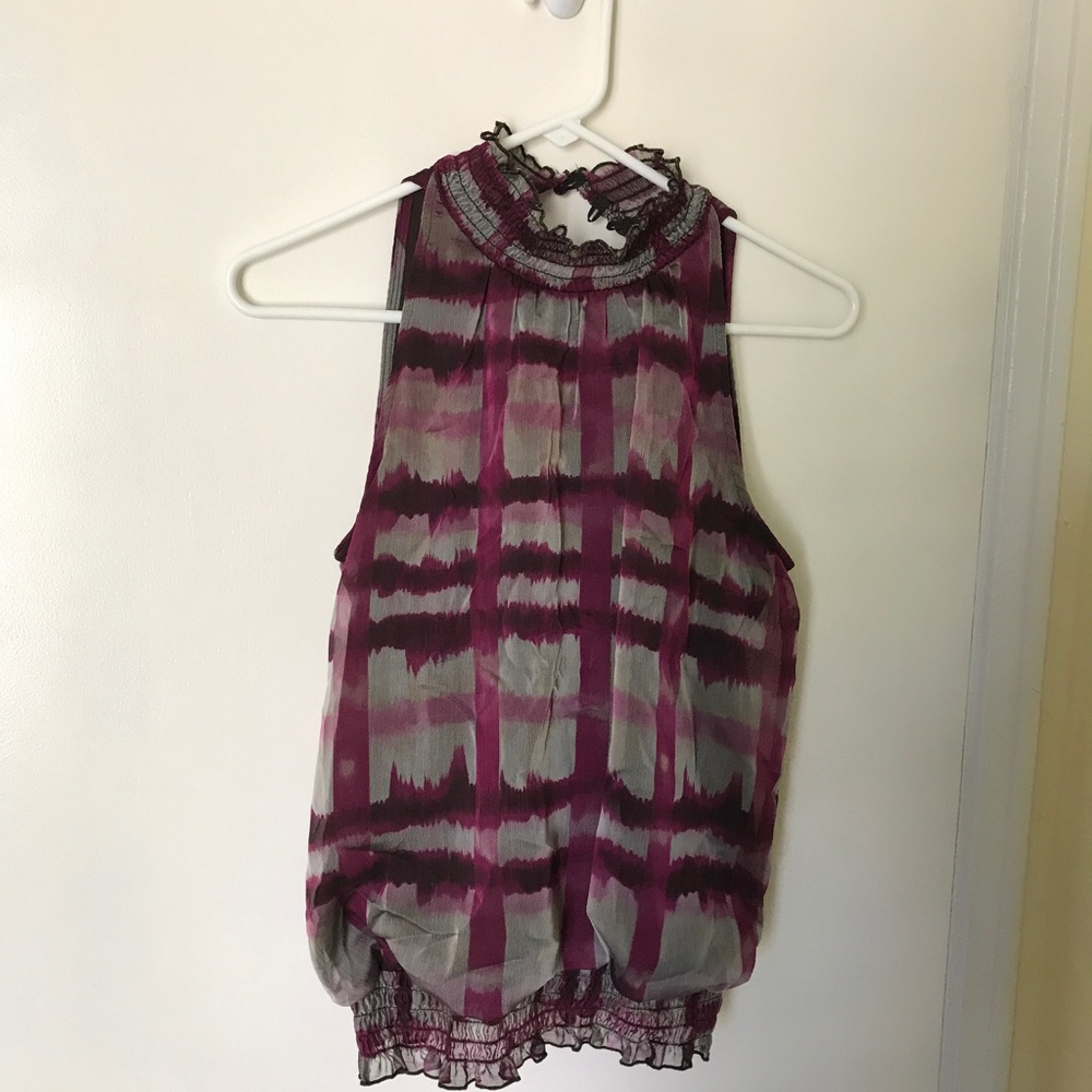 Sleeveless high necked blouse