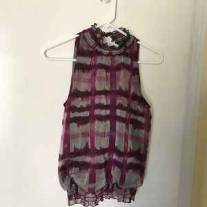 Sleeveless high necked blouse