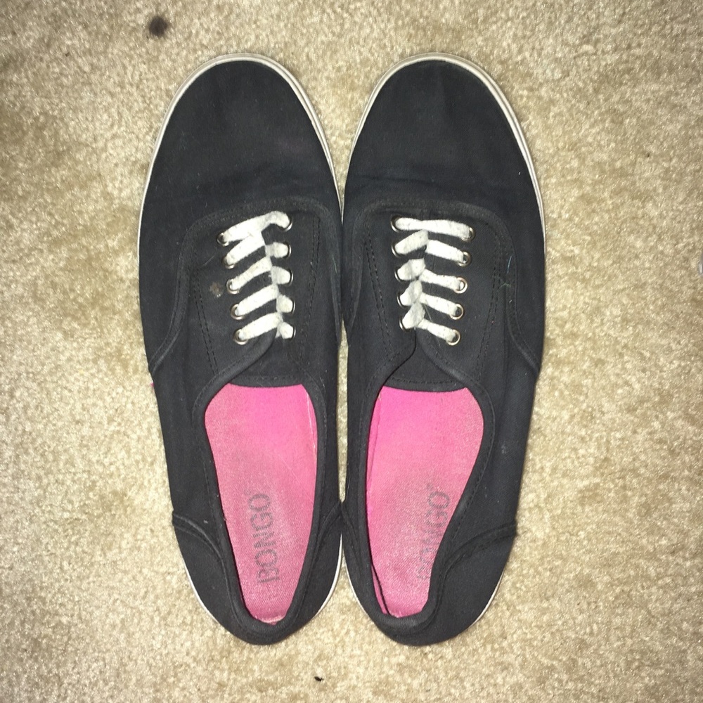 Worn black sneakers