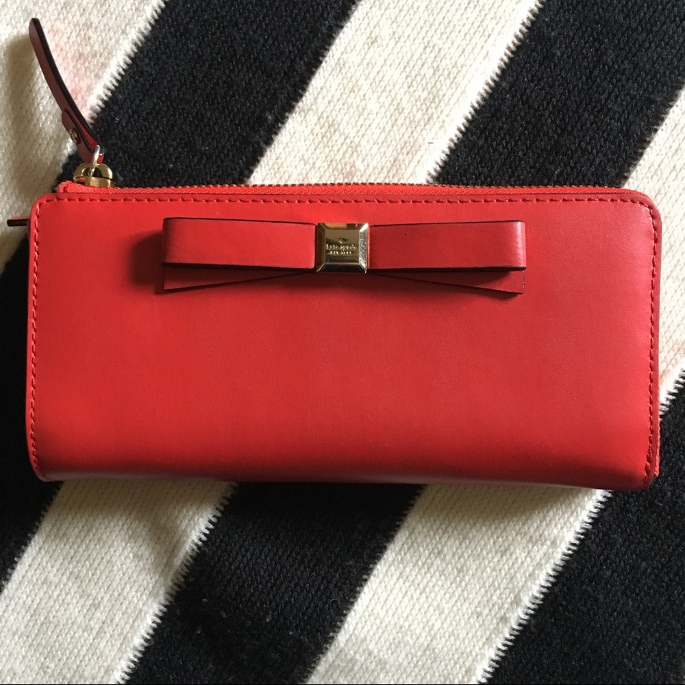 Red Kate Spade wallet with bow detail