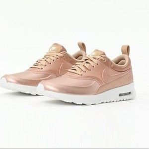 Rose gold Nike shoes