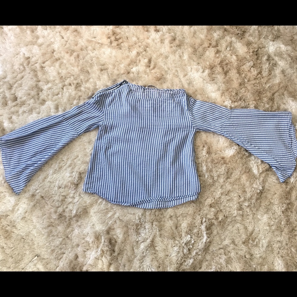 Pinstriped shirt with bell bottom shaped sleeves