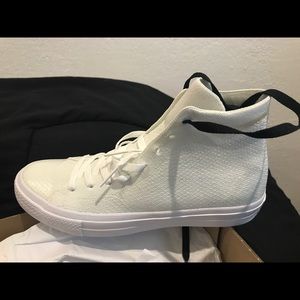 Cream colored high top converse