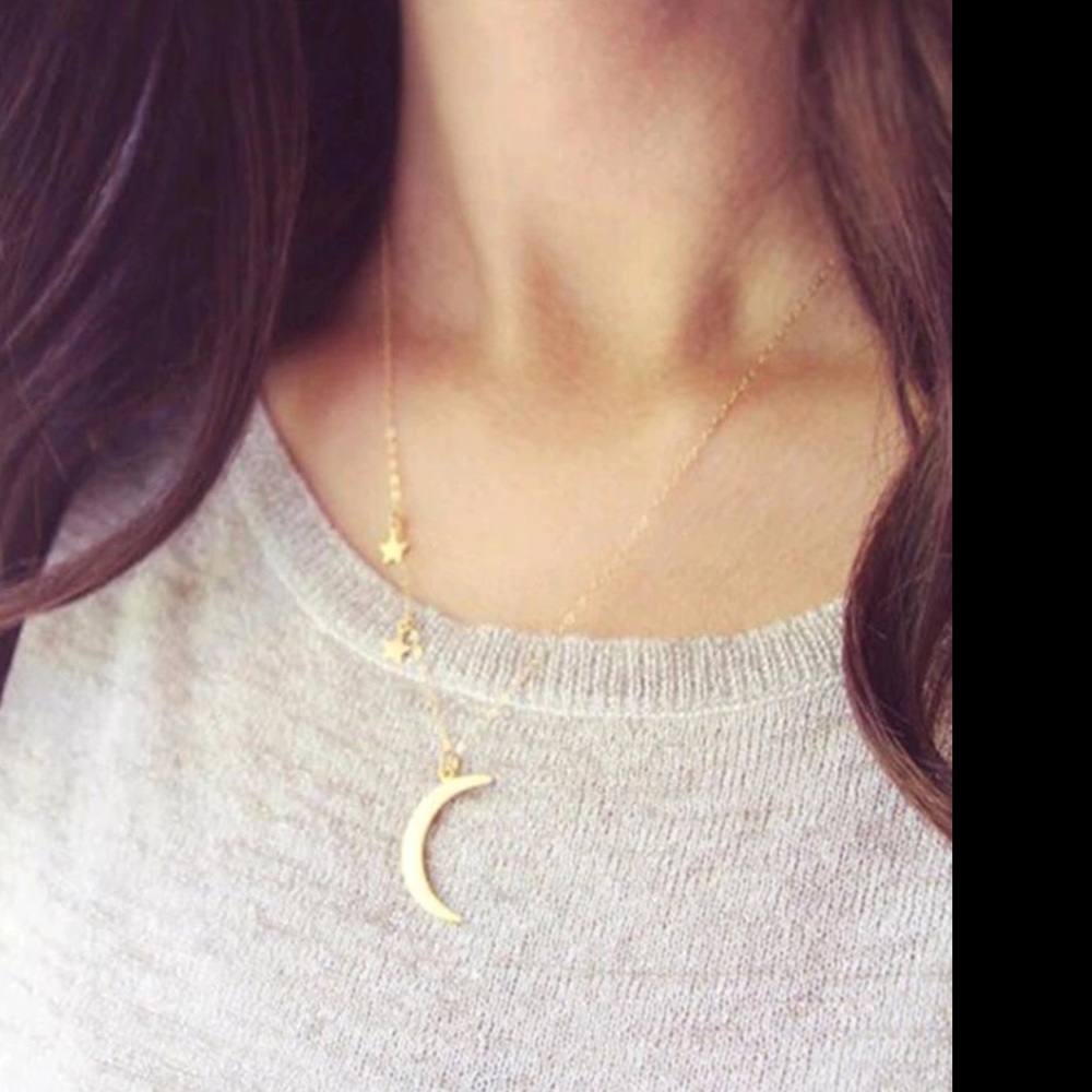 Gold tone crescent moon and stars necklace