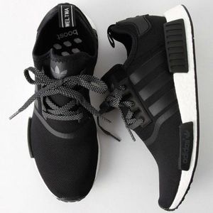 Black and white adidas NMDs