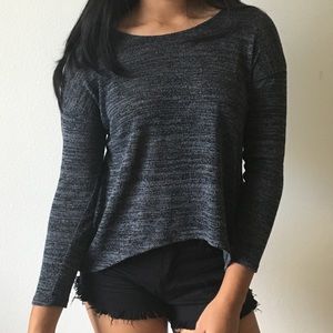 A long sleeve black sweater