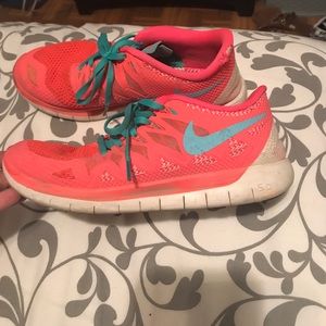 Bright pink Nike Free runs 5.0