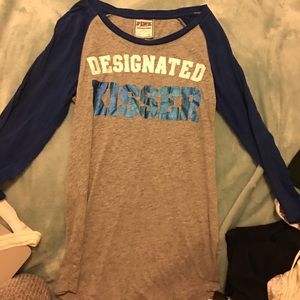 Two sport Victoria secret pink shirts together