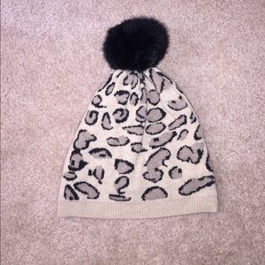 Leopard print hat with pom pom top