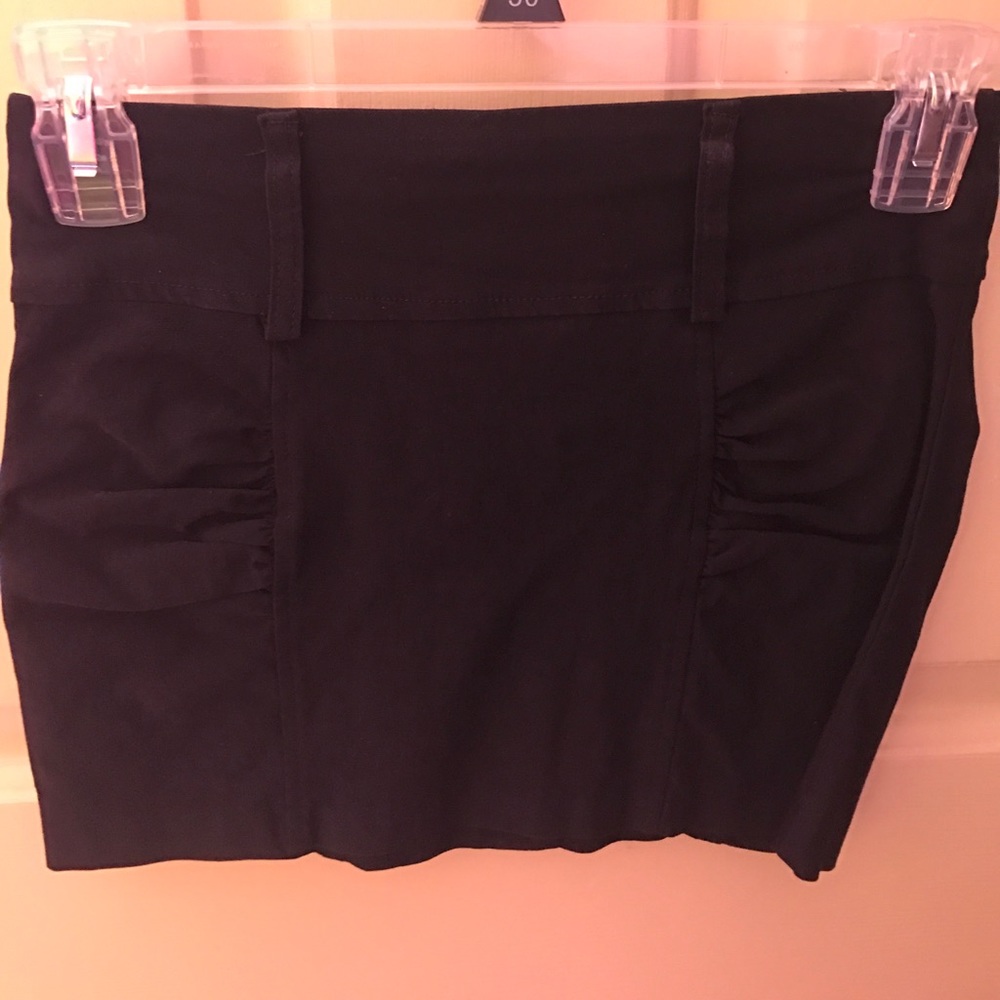 Cute black mini skirt.