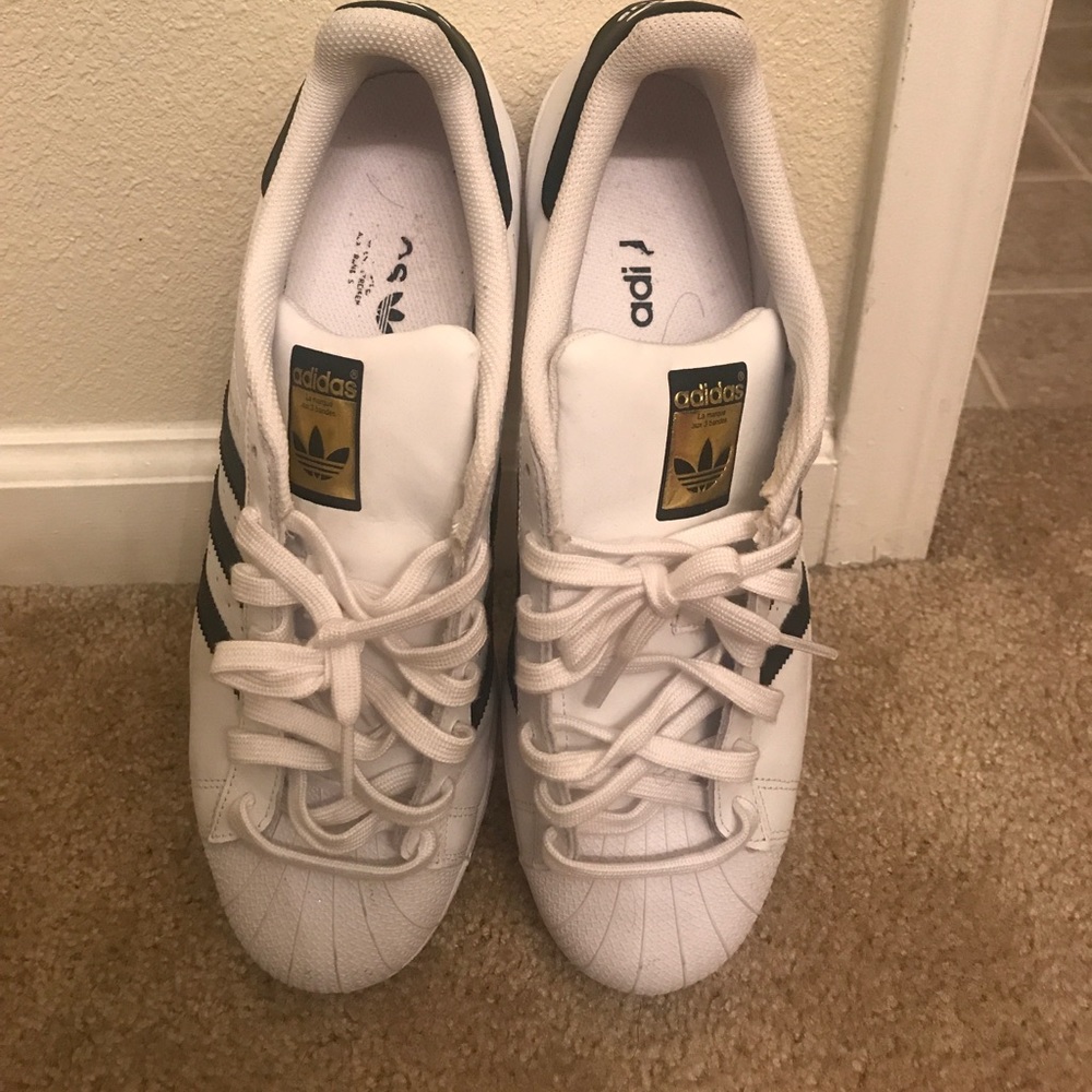 White & black Adidas superstars